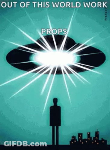 A Man Is Standing In Front Of A Flying Saucer With The Words Out Of This World Work Props Written On It . GIF