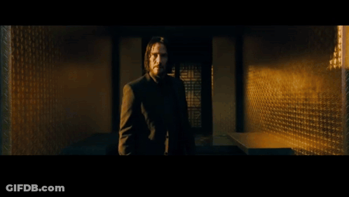 A Man Is Standing In Front Of A Fountain And The Word Parlay Is On The Bottom Right GIF