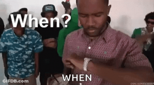 A Man Is Standing In Front Of A Group Of People And Asking When ? When . GIF