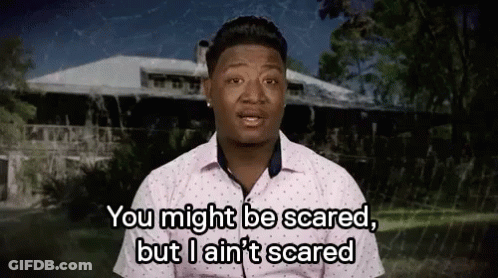 A Man Is Standing In Front Of A House And Saying You Might Be Scared GIF