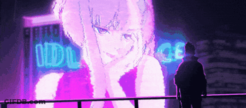 A Man Is Standing In Front Of A Large Neon Sign That Says Idol GIF