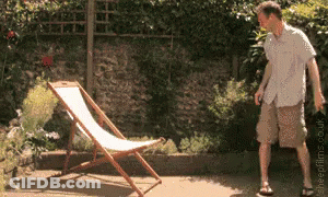A Man Is Standing In Front Of A Lawn Chair With The Website Sheepplace.co.uk Written On The Bottom GIF