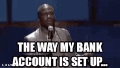 A Man Is Standing In Front Of A Microphone And Saying `` The Way My Bank Account Is Set Up . '' GIF