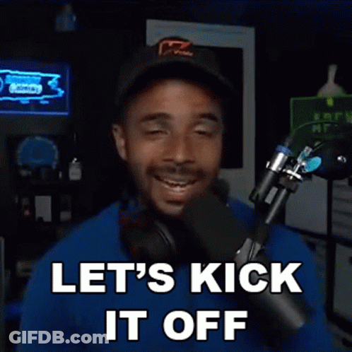 A Man Is Standing In Front Of A Microphone With His Eyes Closed And Says Let 'S Kick It Off . GIF
