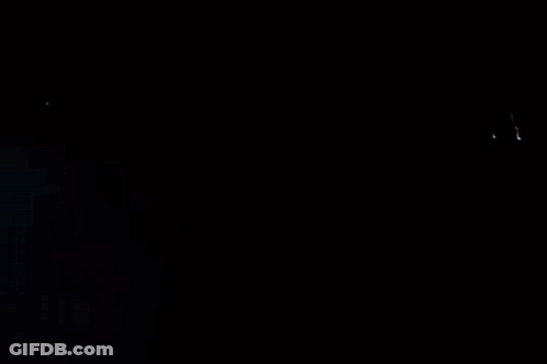 A Man Is Standing In Front Of A Motorcycle In The Fog GIF