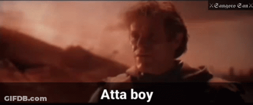 A Man Is Standing In Front Of A Mountain And The Word Atta Boy Is On The Bottom Right GIF