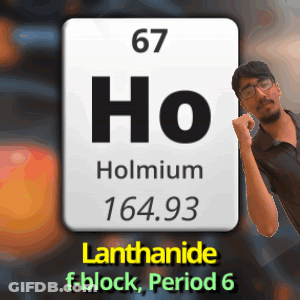 A Man Is Standing In Front Of A Periodic Table Of A Chemical Element Called Holmium GIF