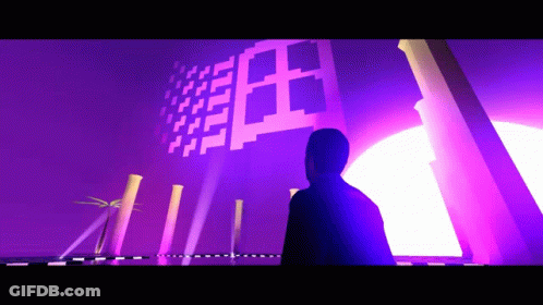 A Man Is Standing In Front Of A Purple Wall That Says ' I ' On It GIF