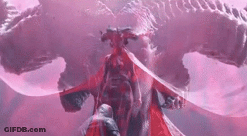 A Man Is Standing In Front Of A Red Dragon With A Sword . GIF