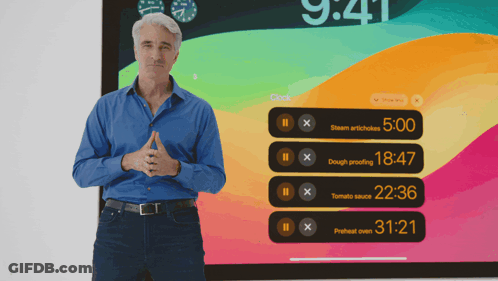 A Man Is Standing In Front Of A Screen That Says 9:41 GIF