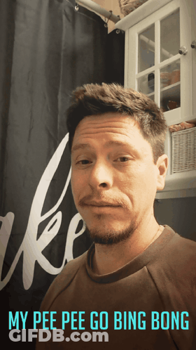 A Man Is Standing In Front Of A Shower Curtain With The Words My Pee Pee Go Bing Bong Written Below Him GIF