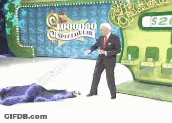 A Man Is Standing In Front Of A Sign That Says 1,000,000 Spectacular GIF