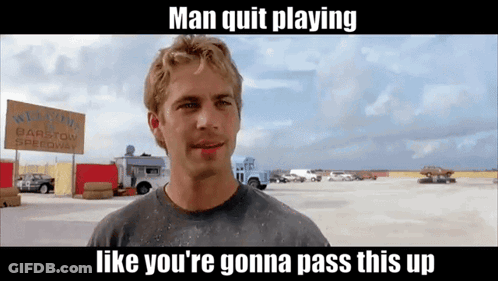 A Man Is Standing In Front Of A Sign That Says Barstow Speedway GIF