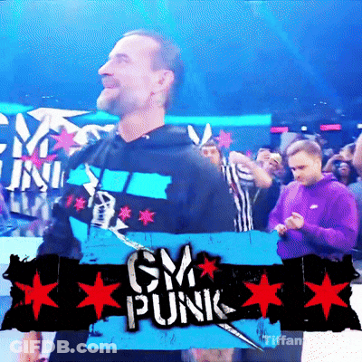 A Man Is Standing In Front Of A Sign That Says Cm Punk GIF