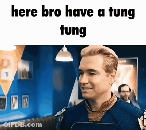 A Man Is Standing In Front Of A Sign That Says Here Bro Have A Tung Tung GIF