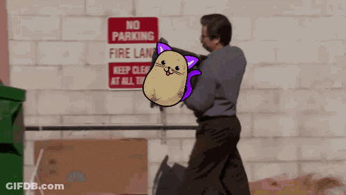 A Man Is Standing In Front Of A Sign That Says No Parking Fire Lane GIF