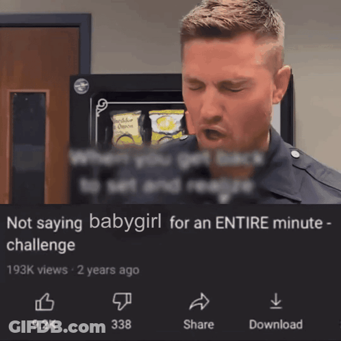 A Man Is Standing In Front Of A Sign That Says Not Saying Babygirl For An Entire Minute Challenge GIF
