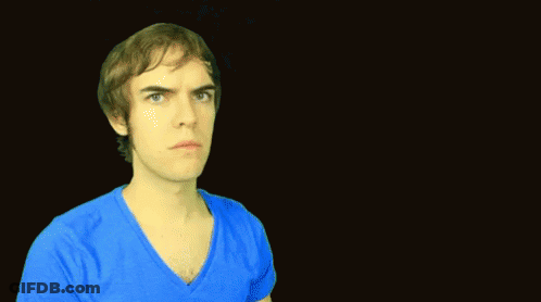 A Man Is Standing In Front Of A Sign That Says Way Too Soon GIF