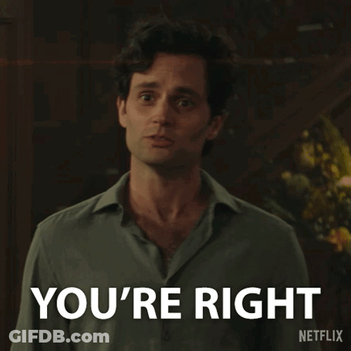 A Man Is Standing In Front Of A Sign That Says You 'Re Right GIF