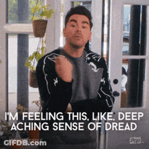 A Man Is Standing In Front Of A Sliding Glass Door And Says I 'M Feeling This Like Deep Aching Sense Of Dread GIF