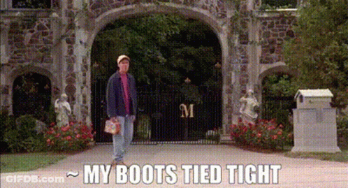 A Man Is Standing In Front Of A Stone Archway With The Words `` My Boots Tied Tight '' Written On The Bottom . GIF