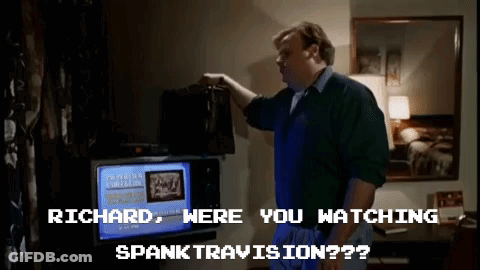 A Man Is Standing In Front Of A Television With The Words " Richard Were You Watching Spanktravision " On The Screen GIF