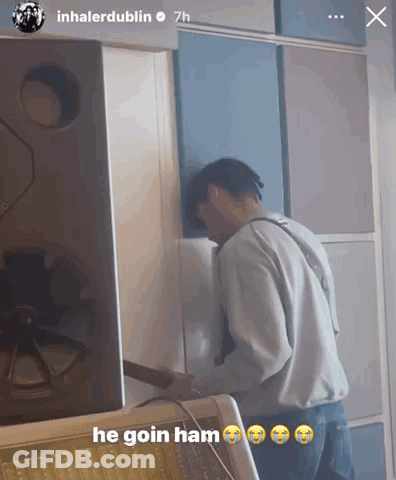 A Man Is Standing In Front Of A Wall With The Caption He Goin Ham GIF