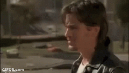 A Man Is Standing In Front Of A Window And Saying `` I 'D Say When The Angels Win The Pennant '' GIF