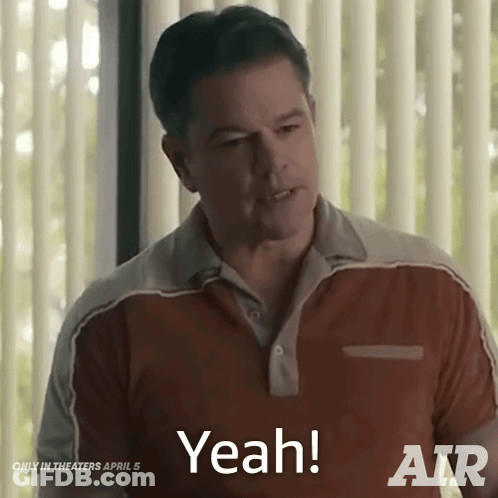 A Man Is Standing In Front Of A Window And Says " Yeah " GIF