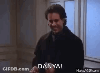 A Man Is Standing In Front Of A Window Holding A Ring And Says `` Dany ! '' GIF