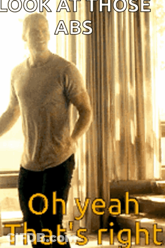 A Man Is Standing In Front Of A Window With The Caption " Look At Those Abs " GIF