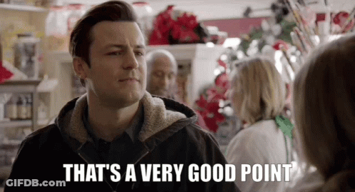 A Man Is Standing In Front Of A Woman In A Store And Says `` That 'S A Very Good Point '' . GIF