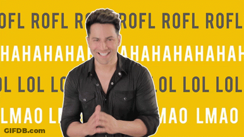A Man Is Standing In Front Of A Yellow Background That Says Lol GIF