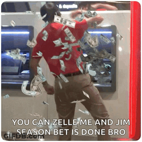 A Man Is Standing In Front Of An Atm Machine With Money Falling From It GIF