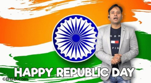 A Man Is Standing In Front Of An Indian Flag With The Words Happy Republic Day Below Him GIF