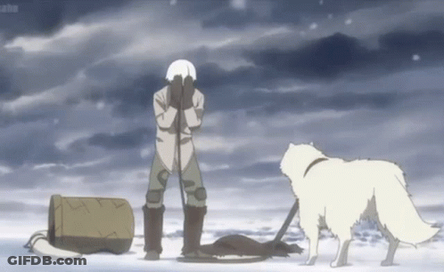 A Man Is Standing In The Snow With His Hands On His Face And A Dog Standing Next To Him . GIF