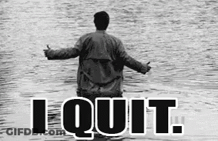A Man Is Standing In The Water With The Words `` I Quit '' Written Above Him . GIF