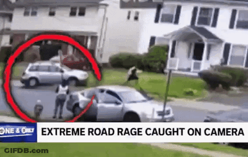 A Man Is Standing Next To A Car In Front Of A House In A Video That Was Caught On A Camera . GIF
