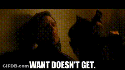 A Man Is Standing Next To A Cat In A Dark Room And Says `` Want Does N't Get . '' GIF