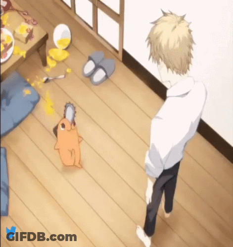A Man Is Standing Next To A Chainsaw Dog On The Floor GIF