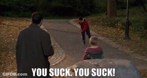 A Man Is Standing Next To A Child On A Sidewalk And Says `` You Suck You Suck '' . GIF