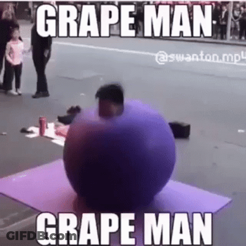 A Man Is Standing Next To A Purple Ball On A Yoga Mat On The Side Of The Road . GIF