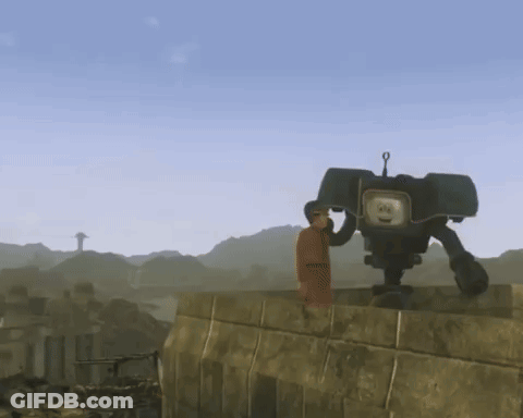 A Man Is Standing Next To A Robot That Has A Face On It GIF