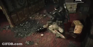 A Man Is Standing Next To A Skeleton In A Room With Blood On The Floor . GIF