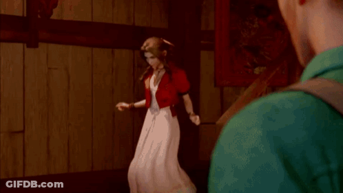 A Man Is Standing Next To A Woman In A Red Dress In Front Of A Mirror . GIF