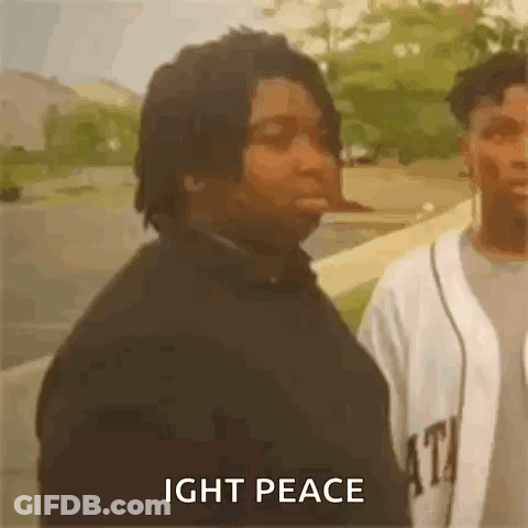 A Man Is Standing Next To Another Man With The Words `` Ight Peace '' Written On The Screen . GIF