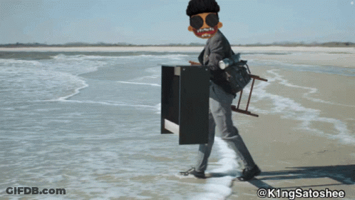 A Man Is Standing On A Beach With A Ladder On His Back And The Hashtag @Kingsatoshee On The Bottom GIF