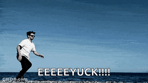 A Man Is Standing On A Beach With The Words Eeeeyuck !!! Behind Him GIF
