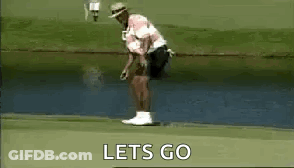A Man Is Standing On A Golf Course Holding A Golf Club In His Hand . GIF