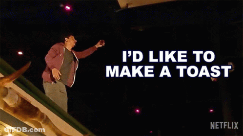 A Man Is Standing On A Roof With The Words " I 'D Like To Make A Toast " Behind Him GIF